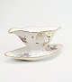 Sauce bowl of 
Royal porcelain 
with patterned 
Saxon flower 
decorated on 
the edge with 
gold. ...