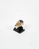 This ring is 
made of 14 
carat gold and 
decorated with 
a beautiful 
amethyst. The 
ring is stamped 
...
