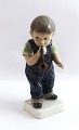 Dahl Jensen. 
Porcelain 
figure. Boy 
with pipe. 
Model 1027. 
Height 17 cm. 
(1 quality)