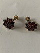 Earrings with 
vise, 
gold-plated 
silver with 
inlaid garnets.
Stamped 830S 
API
Diameter 10.34 
...