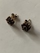 Stud earrings, 
gold-plated 
silver with 
inlaid garnets.
Stamped 925S
Diameter: 9.20 
...