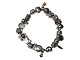 Pandora silver, 
Bracelet with 
14 charms - two 
small one are 
in gold and 
some of the 
silver one ...