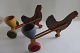"Chiken 
pushcart "
2  old/antique 
chickens, each 
with a pushcart 
with a egg cup. 

They are ...