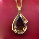 Necklace in 14k 
gold with 
pendant of 
large topaz set 
...