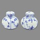 Royal 
Copenhagen 
porcelain.
Royal 
Copenhagen, 
blue fluted 
half lace; Salt 
and pebber set 
#711. ...