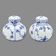 Royal Copenhagen porcelain.Royal Copenhagen, blue fluted half lace; Salt and pebber set #711. ...