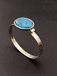 Sterling silver 
bangle 5.9 x 
5.2 cm. with 
turquoise 2.7 x 
2.1 cm. from 
Herman 
Siersb&#65533;l 
...