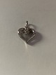 Pendant 14 carat white gold, shaped like a heart
with a diamond