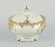 KPM Berlin, 
“Friederike” 
lidded bowl in 
cream 
porcelain. 
Gold 
decoration in 
the form of ...