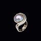 Birgitte 
Buchhave Munch. 
14k White and 
Yellow Gold 
Ring with Mabé 
Pearl.
Designed and 
crafted ...