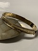 14 carat bangle with chisels.