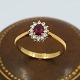 Ring in 18k gold set with a ruby and 12 diamonds in white gold, total 0.24 ct. Ring size ...