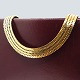 Geneve gold 
jewellery.
Alf Sørensen; 
A wide Danish 
geneve necklace 
of 14k gold. 
Clasp with two 
...