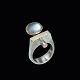Ole Waldemar 
Jacobsen. 
Sterling Silver 
Ring with 21k 
Gold and 
Moonstone.
Designed and 
crafted ...