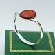 N. E. From 
silver 
jewellery.
N. E. From; A 
bangle of 
sterling silver 
set with amber.
Inner ...