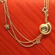 Ole Lynggaard; A diamond snail clasp of 18k gold.