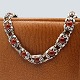 N. E. From; A necklace of sterling silver with amber