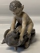 Royal Copenhagen, figure Pan on bear Chr Thomsen.