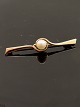 14 carat gold 
brooch L. 5 cm. 
with genuine 
pearl subject 
no. 596606