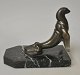 Art Deco 
bookend in the 
shape of a sea 
lion in 
patinated 
metal, made by 
Frecourt, 
France, c. ...