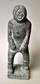 Greenlandic 
soapstone 
figure of a 
standing man 
with an anorak, 
20th century. 
Signed LJ 1984. 
H.: ...