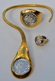 Jacob Hull 
(Boch & 
Deichmann) 
jewelery set in 
gilded brass 
with glass, 
20th century 
Denmark. Set 
...