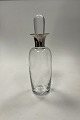 Holmegaard 
Glass Carafe in 
clear glass 
with silver 
neck
Measures 
30,5cm / 12.01 
inch
