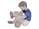 Bing & Grondahl 
figurine, boy 
with football.
The factory 
mark shows, 
that this was 
made ...