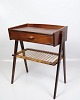 Teak bedside 
table with a 
drawer and a 
wicker shelf, 
designed by 
Søren Rasmussen 
in the 1960s. 
...