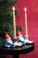 Old Christmas 
candlestick in 
painted bisque 
(porcelain) of 
Santa Claus 
lying down 
holding a ...