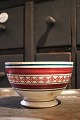 Large old French cafe latte bowl in faience with a fine pattern in red and green 
colors and with a super fine patina...