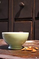 Old cafe latte bowl in earthenware with mint-green color and fine patina...