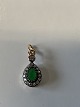 Pendant in 14 carat gold, with green emerald and white stones.