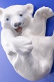 Royal 
Copenhagen 
porcelain 
figurine. Polar 
bear nr. 072 or 
729, length 
10.5 cm. height 
6 cm. 1. ...