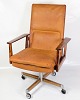 Office chair, 
Model 419 with 
a frame of 
rosewood, seat 
and back 
upholstered in 
cognac leather. 
...