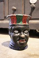 Antique 19th 
century, 
painted 
terracotta 
flower pot 
in the shape 
of the head of 
a black ...