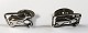 Silver 
cufflinks (830) 
with fish 
motif. Length 
21 mm.