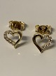 Beautiful heart 
studs in 18 
carat gold, 
with embedded 
zircons. The 
ear studs are 
small and ...