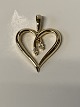 Gold Pendant 
Heart with two 
diamonds in 14 
carat gold
Stamped 585
Height with 
awl 21.85 ...