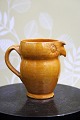 Decorative "Lillerod" owl jug in glazed earthenware in fine ochre yellow glaze. 
Height: 9.5cm...