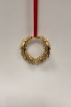 Georg Jensen 
Golden 
Christmas Door 
Wreath, Small. 
Gold plated. 
Designed by 
Henrik Holbæk 
and ...