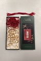 Georg Jensen 
Golden 
Christmas 
Christmas 
clips. Box of 
20 pieces and 4 
strings for 
hanging ...