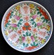 Chinese porcelain plate, polychron decorated, 19th century Motif with flowers and script. ...