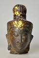 Oriental Buddha 
figure in 
bronze, 19th 
century Cire 
perdue. With 
remains of 
gilding. H.: 
11.5 cm.