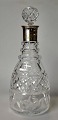 Crystal 
decanter with 
silver 
mounting, 20th 
century. Danish 
silver mounting 
from 1950. H.: 
31 ...