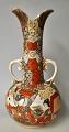 Japanese 
satsuma vase 
with two 
handles, 19th 
century. 
Hand-painted 
decorations 
with children 
and ...