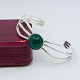 Niels Erik From; A bangle of sterling silver set with ...