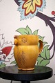 Decorative "Lillerod" owl jug in glazed earthenware in a fine ochre glaze. 
Height: 11.5cm...