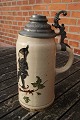 Large pitcher in faience with tin lid, decorated 
with a pixie