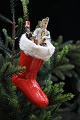 Old Christmas tree ornament in the shape of a small boot in painted papier-mâché 
with a cotton border and  filling...